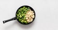 Frozen vegetables in a frying pan on a white background. Cabbage mix. Broccoli, cauliflower, Brussels sprouts. Copy space, view Royalty Free Stock Photo