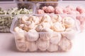 Frozen vegetables and semi-finished meat products in plastic containers on a white plate. meatballs, dumplings, chopped beans Royalty Free Stock Photo