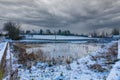 Frozen village pond in winter of 2021  Hawkesbury Upton  The Cotswolds Royalty Free Stock Photo