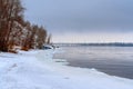 Frozen Volga River coast, winter landscape with snow and mountains Royalty Free Stock Photo