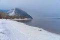 Frozen Volga River coast, winter landscape with snow and mountains Royalty Free Stock Photo