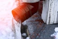 frozen water in downspout gutter of the roof drainage system with ice