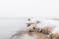 Frozen water on the shore of the beach. foggy weather Royalty Free Stock Photo