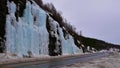 Frozen waterfall besides main road European route E8 near Nordkjosbotn, Troms og Finnmark, Norway in winter time.
