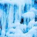 Frozen waterfall of blue icicles Royalty Free Stock Photo