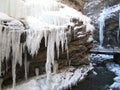 Frozen waterfall with huge beautiful icicles hanging from the rocks Royalty Free Stock Photo