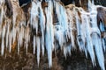 A frozen waterfall with ice in a blue and white color in winter Royalty Free Stock Photo