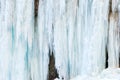 A frozen waterfall with ice in a blue and white color in winter Royalty Free Stock Photo