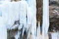 A frozen waterfall with ice in a blue and white color in winter Royalty Free Stock Photo