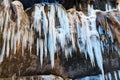 A frozen waterfall with ice in a blue and white color in winter Royalty Free Stock Photo