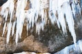A frozen waterfall with ice in a blue and white color in winter Royalty Free Stock Photo