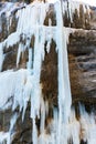 A frozen waterfall with ice in a blue and white color in winter Royalty Free Stock Photo