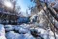 Frozen waterfall and starburst sun at plitvice lakes, Croatia