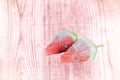 Frozen watermelon slices on pink wooden background Royalty Free Stock Photo