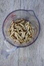 Waxworms in a measuring cup Royalty Free Stock Photo