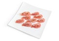 Frozen shrimps on square dish on a white background