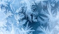 Frozen Window with Intricate Ice Crystal Patterns in Shades of Blue and White Royalty Free Stock Photo