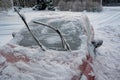 Frozen windscreen and snow on car a cold winterday