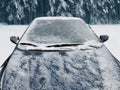 Frozen winter car covered snow, view front window windshield and hood Royalty Free Stock Photo