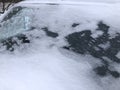 Frozen winter car covered snow, view front window windshield on snowy background Royalty Free Stock Photo