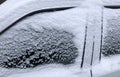 Frozen winter car covered snow, view side window on snowy background Royalty Free Stock Photo