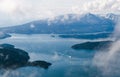 Frozen winter seascape with boat sailing in bay Royalty Free Stock Photo