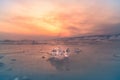 Frozen winter water lake with ice close up selective focus during sunset Royalty Free Stock Photo