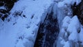 Frozen Winter Waterfall Guk in the Carpathian Mountains in the Forest