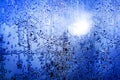 Frozen winter window, glass with frosty patterns, hoarfrost texture, snowflakes, New Year or Christmas ornament for banner Royalty Free Stock Photo