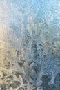 Frozen winter window with shiny ice frost pattern texture. Christmas wonder symbol, abstract background. Extreme north