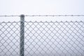 Frozen wire fence. Airport metal fence covered in ice Royalty Free Stock Photo