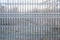 Frozen wire fence with clear ice on its steel wire frame, creating an abstract icy background pattern. Rare meteo event Royalty Free Stock Photo