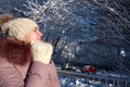 Frozen woman posing in winter park