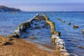 Frozen wooden breakwaters line at Baltic Sea