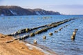 Frozen wooden breakwaters line at Baltic Sea