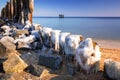 Frozen wooden breakwaters line at Baltic Sea