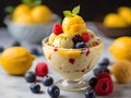 Frozen yogurt or ice cream with lemon, mango, blueberries - healthy summer dessert Royalty Free Stock Photo