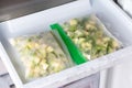 Frozen zucchini cubes in the freezer. Frozen Food Concept