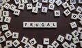 Frugal letter tiles Royalty Free Stock Photo