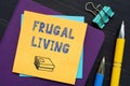 FRUGAL LIVING text in search line. Broker looking at smartphone