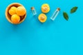 Fruit aroma oil. Apricot kernel oil on blue background top view frame copy space Royalty Free Stock Photo