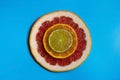 Fruit background. Sliced citrus fruit on a blue background. Flat lay, top view. Juicy ripe grapefruit, orange, lime, lemon. Fruit Royalty Free Stock Photo