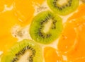 Fruit background. Sliced kiwi, orange, mandarin Royalty Free Stock Photo
