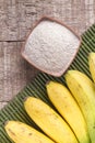 Fruit and banana powder on the wooden table Musa paradisiaca