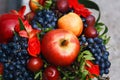 Fruit basket with apples, grapes and cherries