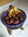 Fruit basket filled with local Indonesian fruits. Basked contains Salak fruit and Bananas. Bali fruit bowl. Healthy snacks