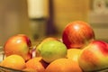 Fruit basket with orange, apple and lime with blurred background and copy space. Royalty Free Stock Photo