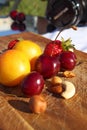 Fruit and berries on a cutting board proper food preparation home cooking foodphoto