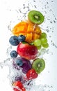Fruit and berries in water splash, isolated on white background Royalty Free Stock Photo