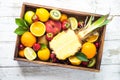 Fruit and berries in wooden tray top view.. Royalty Free Stock Photo